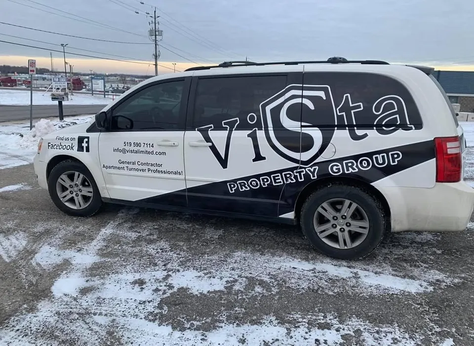 Vista Property Group branded service van parked on a snowy lot